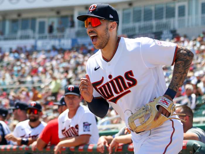 Mar 27, 2022; Fort Myers, Florida, USA; Minnesota Twins shortstop Carlos Correa (4) takes on the field prior to the first inning of the game against the Boston Red Sox during spring training at CenturyLink Sports Complex.